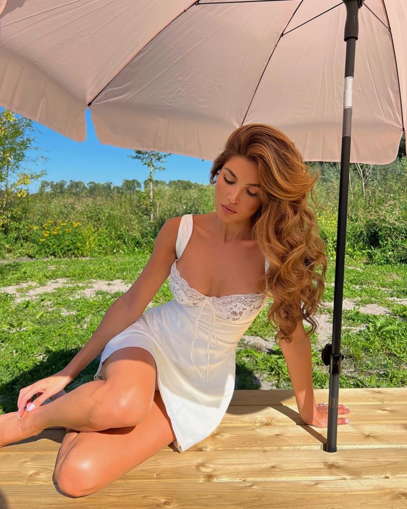 Photo By Negin Mirsalehi On May 28 2024. May Be An Image Of 1 Person Slip Umbrella Parasol Sundress And Outdoors